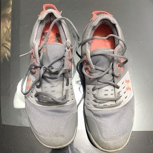 Tennis Under Amour, made in Vietnam. Size USA 10,UK 9. Grey. Fairly used.